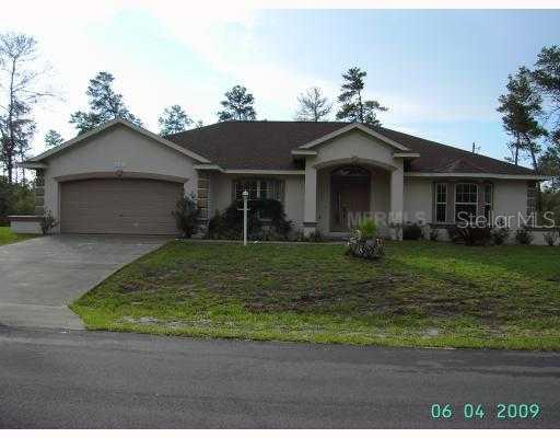 2981 Southwest 173rd Street Road Ocala, FL 34473 - Photo 1 of 1 a front view of a house with a yard
