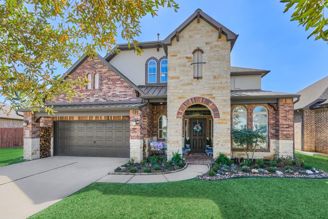 226 Hampton Glen Road Montgomery, TX 77356 - Photo 1 of 48 This charming two-story home features a mix of brick and stone exterior, with a welcoming archway entrance and elegant landscaping. It includes an oversized two-car garage.