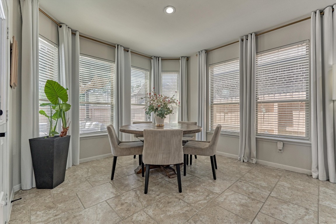 226 Hampton Glen Road Montgomery, TX 77356 - Photo 11 of 48 Bright breakfast room with large windows and neutral tile flooring.