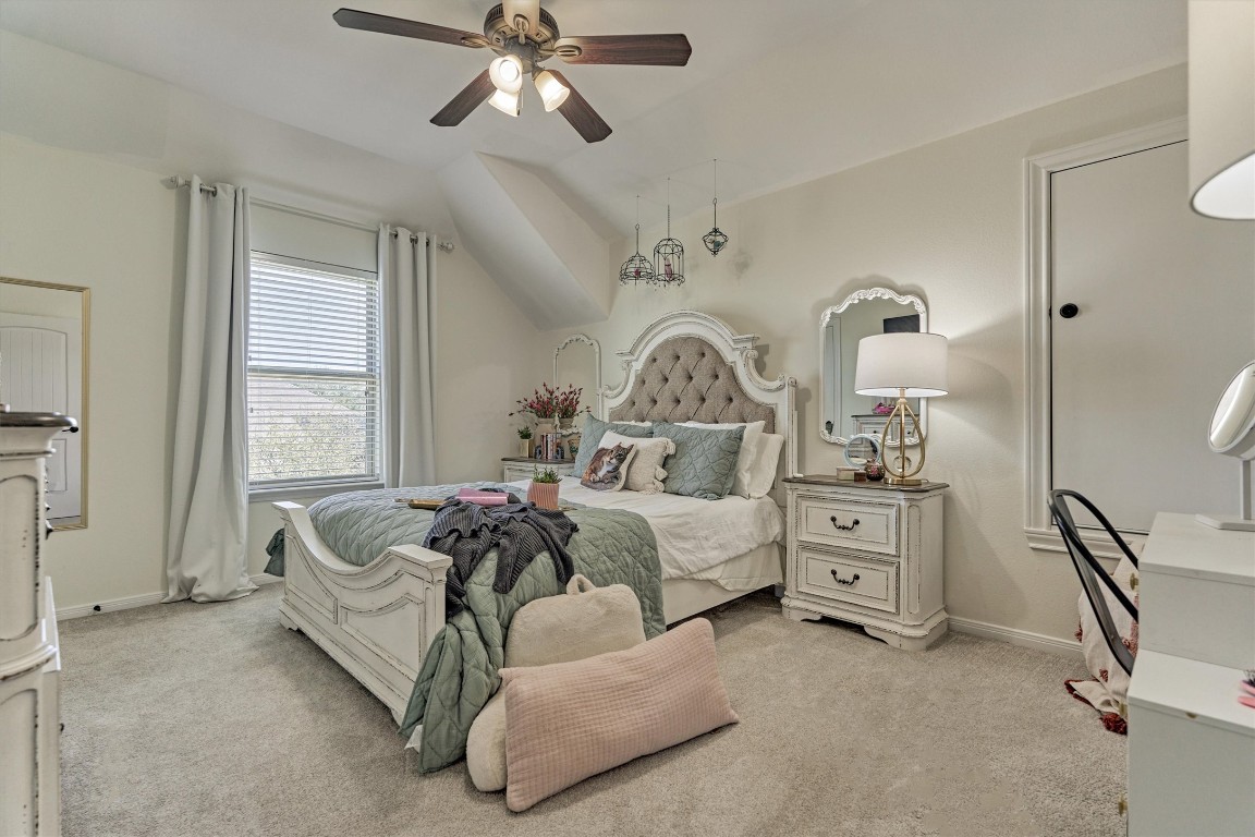 226 Hampton Glen Road Montgomery, TX 77356 - Photo 28 of 48 This cozy secondary bedroom features soft carpeting, neutral walls, and ample natural light create a warm, inviting atmosphere. A ceiling fan and stylish decor add charm and functionality.