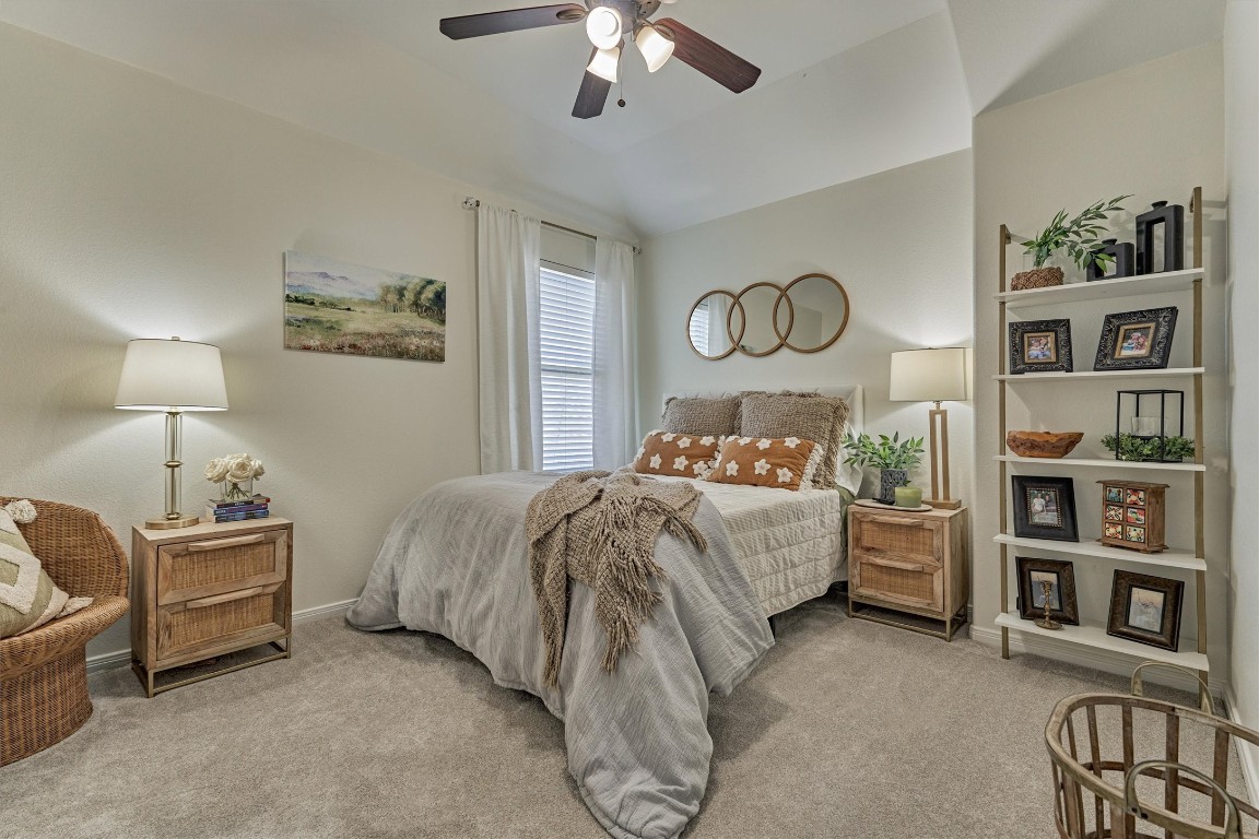 226 Hampton Glen Road Montgomery, TX 77356 - Photo 30 of 48 Secondary bedroom features soft carpeting, neutral walls, and a ceiling fan.