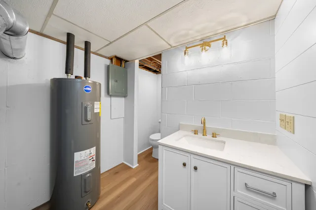 a bathroom with a sink and mirror