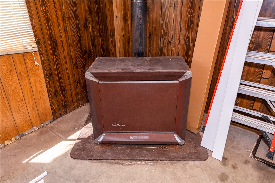 1217 Jasper Road Xenia, OH 45385 - Photo 53 of 62 This functional woodburning stove in garage. Not warranted