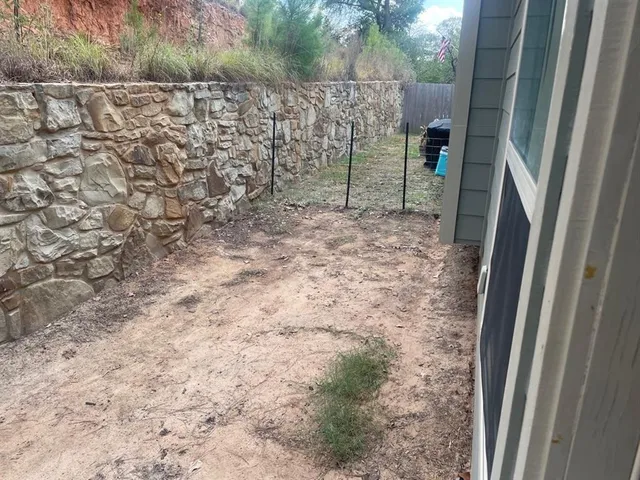 a view of a pathway to a yard