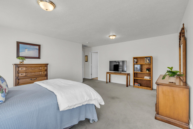 1060 West 2620th Street South Mapleton, UT 84664 - Photo 26 of 87 Bedroom featuring light carpet and baseboards