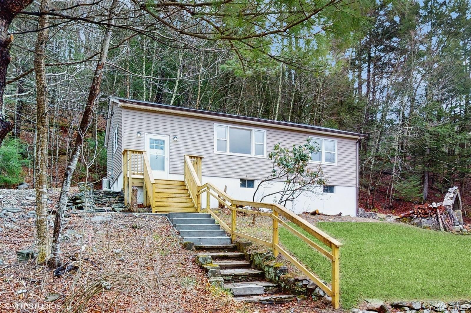 736 State Rte 55 Napanoch, NY 12458 - Photo 18 of 49 featuring a front lawn, stairway, and a forest view