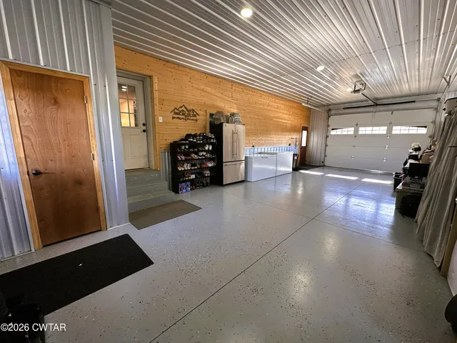 a view of a hallway with seating area