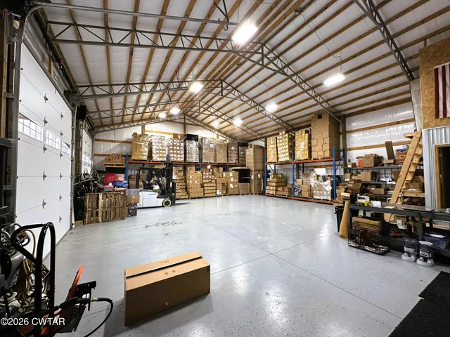 a gym with lots of furniture and a chandelier