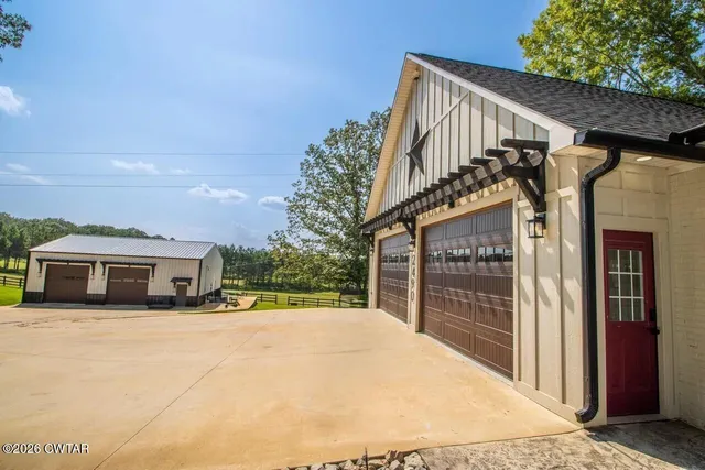 a view of a house with a wooden deck