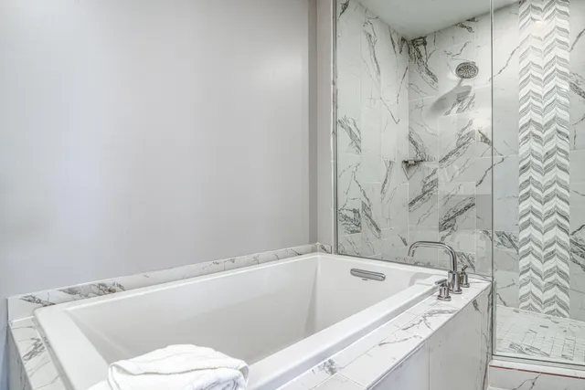 a bathroom with a bathtub and a toilet