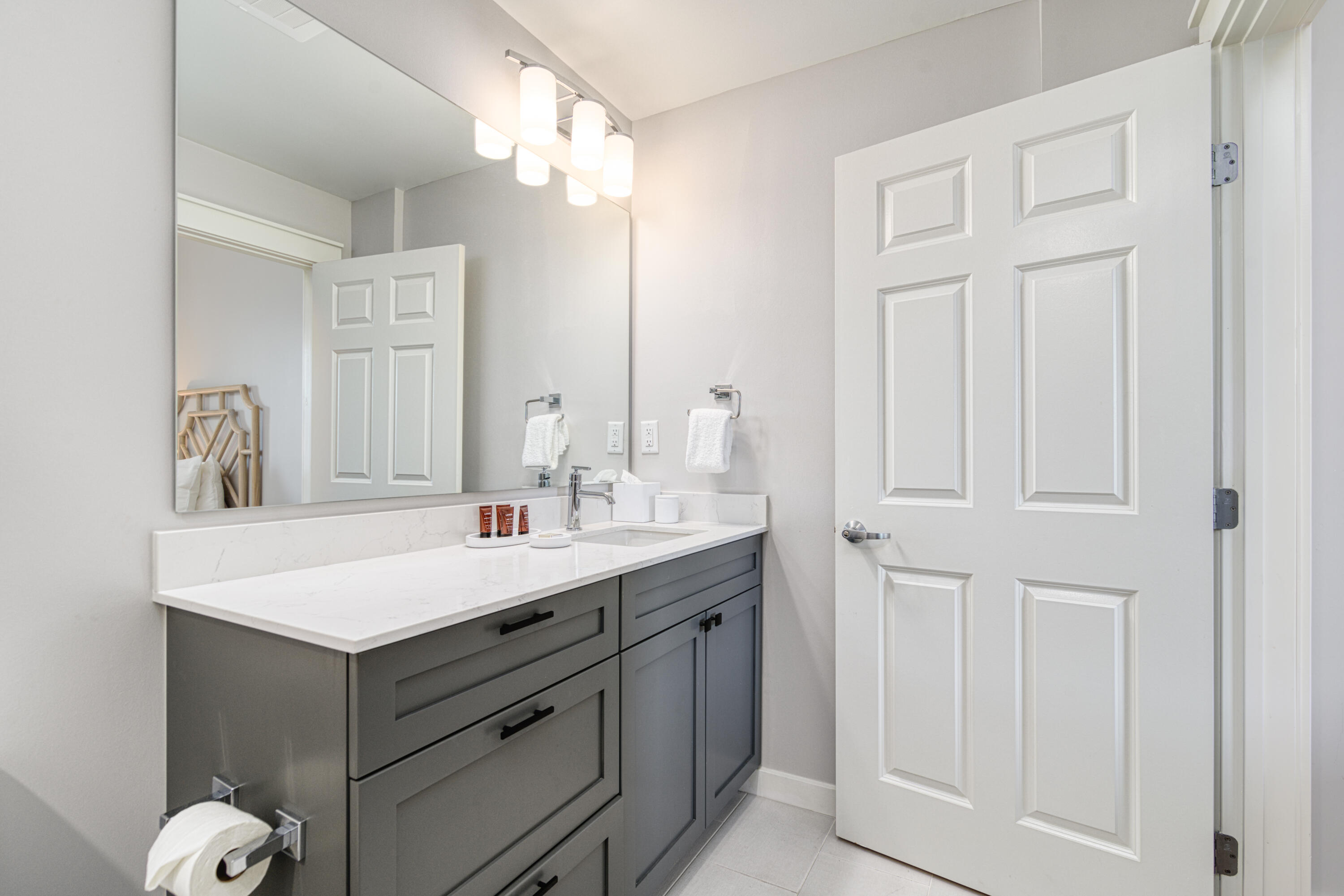 9000 Heron Walk Drive, Unit 3104 Miramar Beach, FL 32550 - Photo 30 of 45 a bathroom with a sink vanity and a mirror