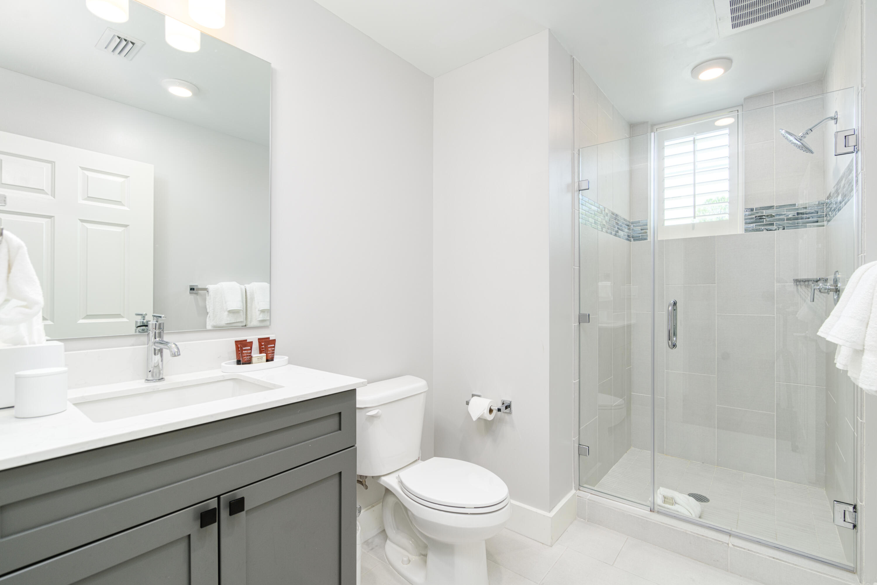 9000 Heron Walk Drive, Unit 3104 Miramar Beach, FL 32550 - Photo 36 of 45 a bathroom with a sink a toilet and shower