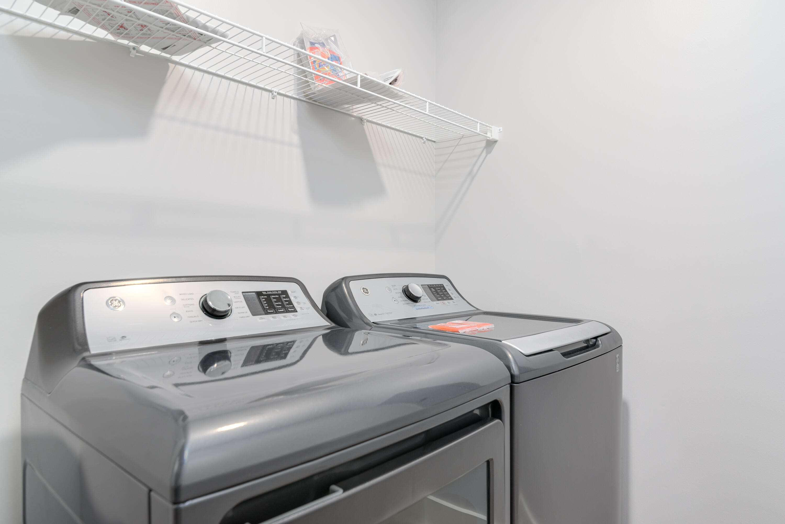 9000 Heron Walk Drive, Unit 3104 Miramar Beach, FL 32550 - Photo 6 of 45 a utility room with dryer and washer