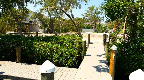 a view of a patio with swimming pool and sitting area