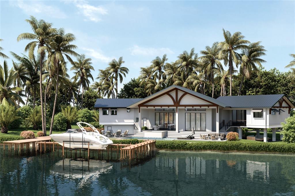 7233 Midnight Pass Road Sarasota, FL 34242 - Photo 2 of 13 a front view of a house with a garden and swimming pool