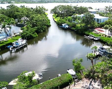 7233 Midnight Pass Road Sarasota, FL 34242 - Photo 9 of 13 an aerial view of a house with outdoor space and lake view