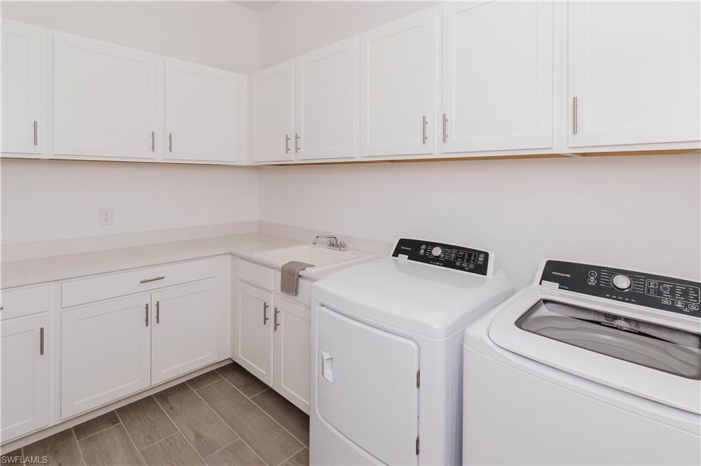 5423 Ternberry Road Ave Maria, FL 34142 - Photo 13 of 46 a utility room with dryer and washer