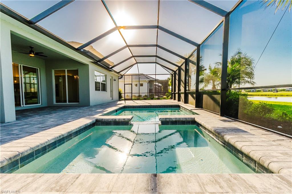 5423 Ternberry Road Ave Maria, FL 34142 - Photo 17 of 46 a view of a house with a yard