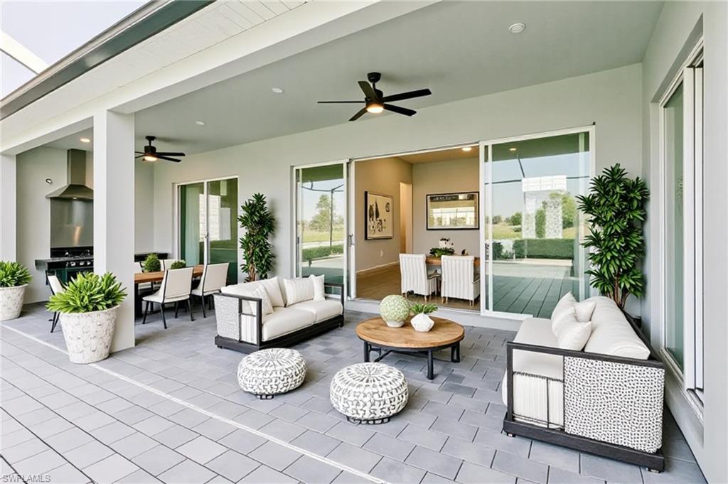 5423 Ternberry Road Ave Maria, FL 34142 - Photo 18 of 46 a living room with furniture and a large window