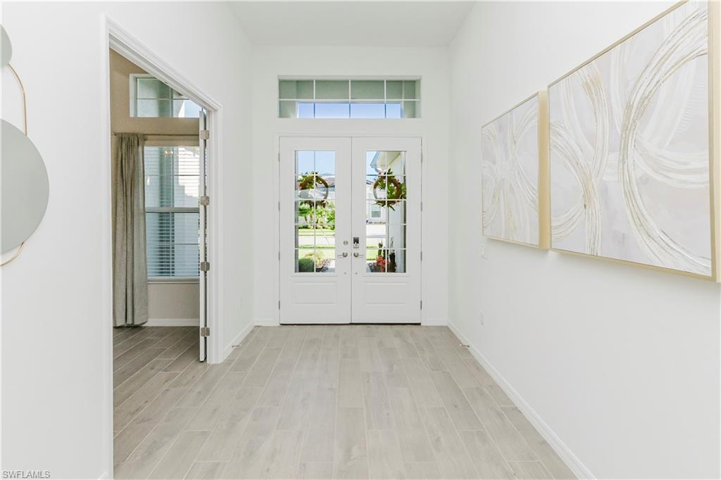 5423 Ternberry Road Ave Maria, FL 34142 - Photo 2 of 46 a view of an empty room with a window