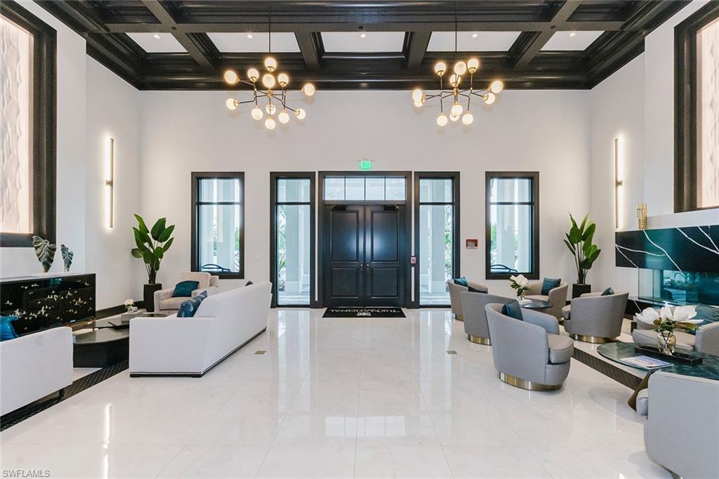 5423 Ternberry Road Ave Maria, FL 34142 - Photo 23 of 46 a lobby with furniture and chandelier