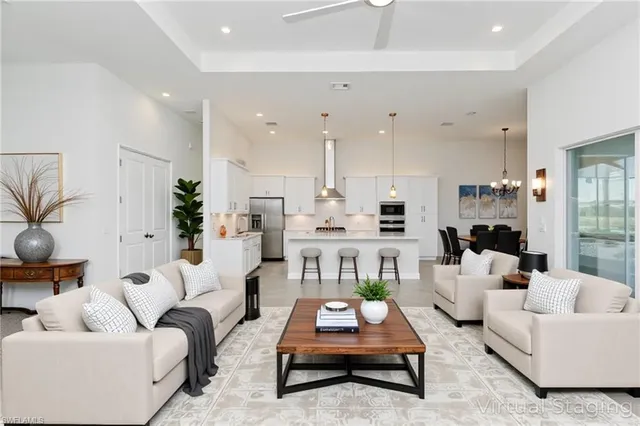 a kitchen with a sink a refrigerator and a stove