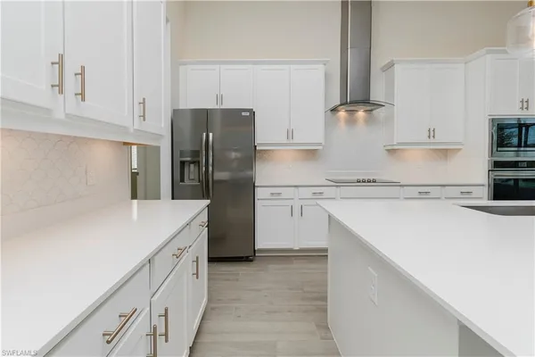 a kitchen with granite countertop a stove and a sink