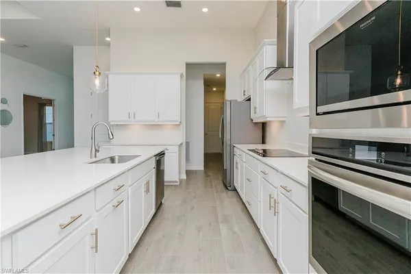a view of a kitchen and a chandelier