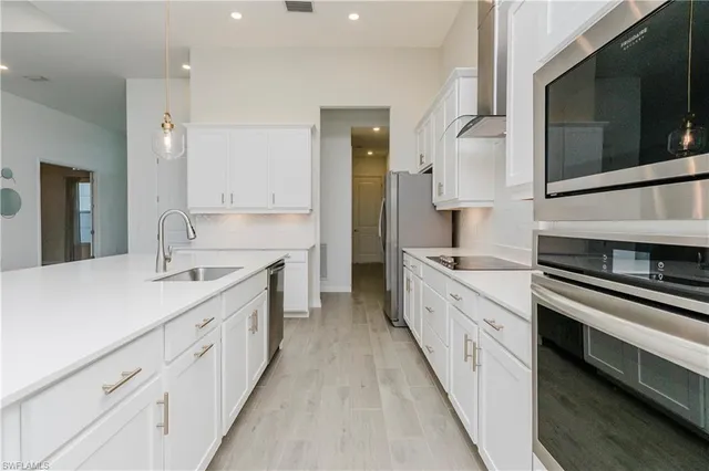 a view of a kitchen and a chandelier