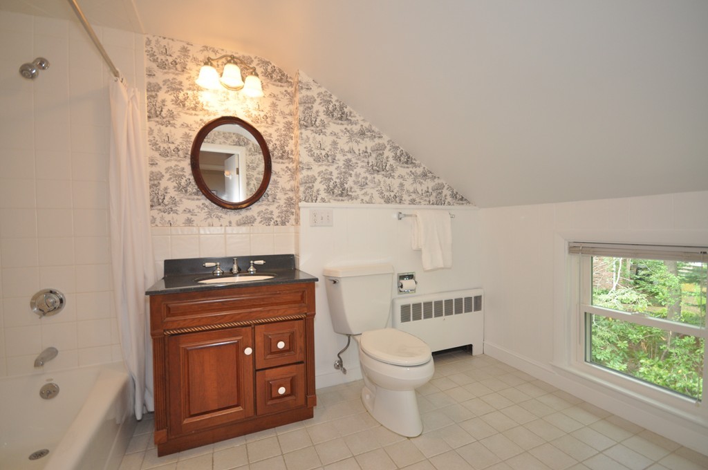 16 Childs Road Lexington, MA 02421 - Photo 17 of 29 a bathroom with a toilet a sink and a bathtub