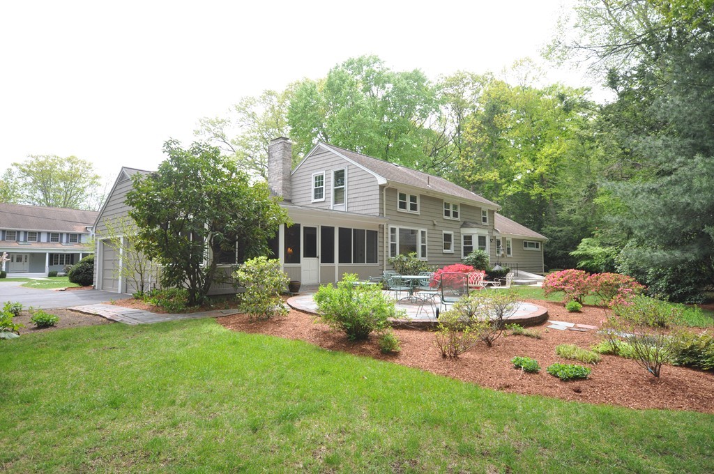 16 Childs Road Lexington, MA 02421 - Photo 25 of 29 a front view of a house with garden and trees