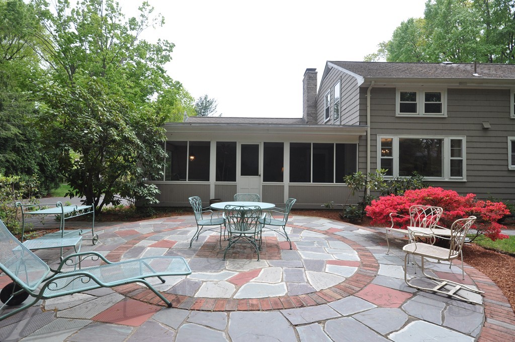 16 Childs Road Lexington, MA 02421 - Photo 26 of 29 a view of a patio with table and chairs and potted plants