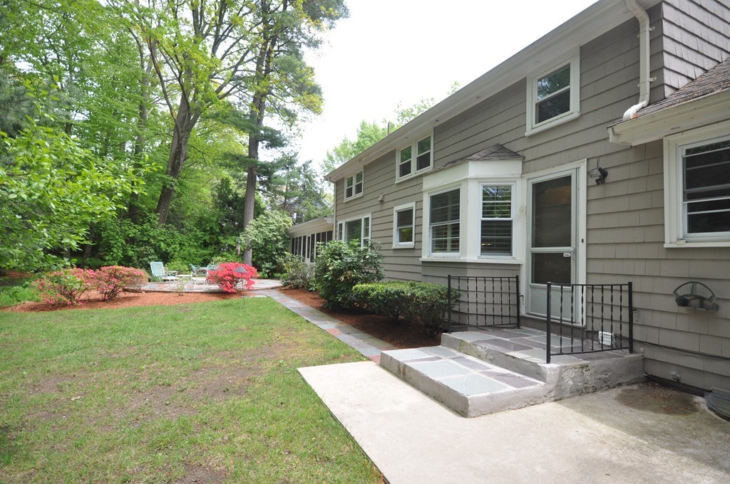 16 Childs Road Lexington, MA 02421 - Photo 28 of 29 a view of a house with backyard and a garden