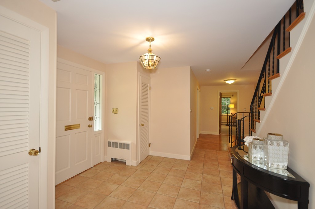 16 Childs Road Lexington, MA 02421 - Photo 4 of 29 a view of a hallway with wooden floor and staircase