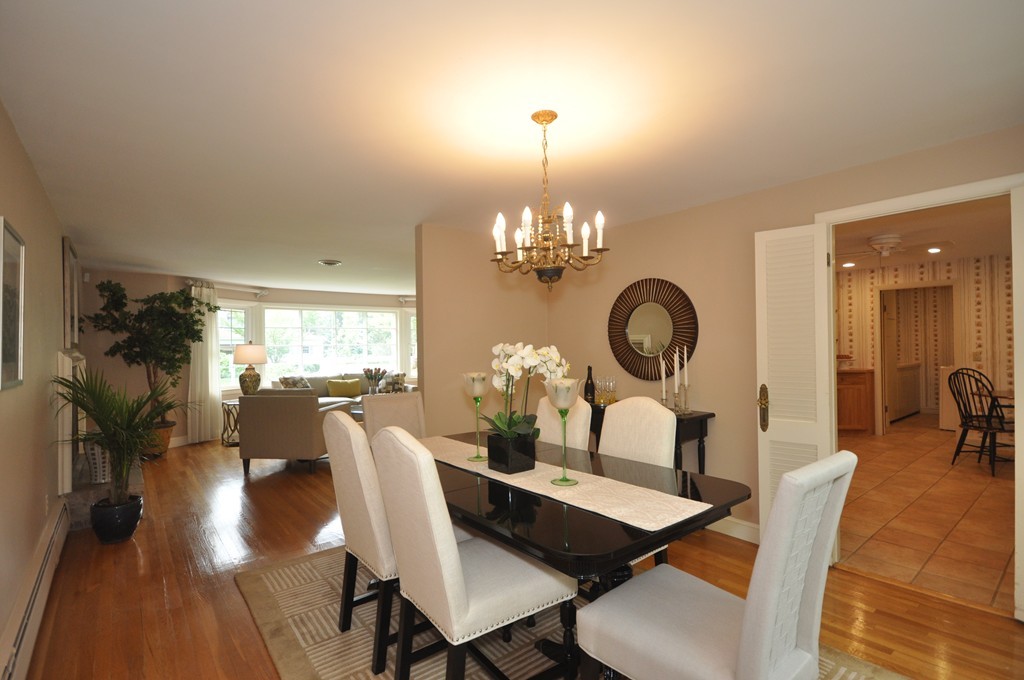 16 Childs Road Lexington, MA 02421 - Photo 8 of 29 a dining room with furniture a chandelier and wooden floor