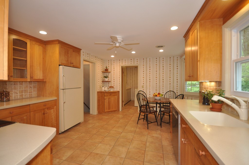 16 Childs Road Lexington, MA 02421 - Photo 9 of 29 a kitchen with stainless steel appliances a refrigerator sink and cabinets