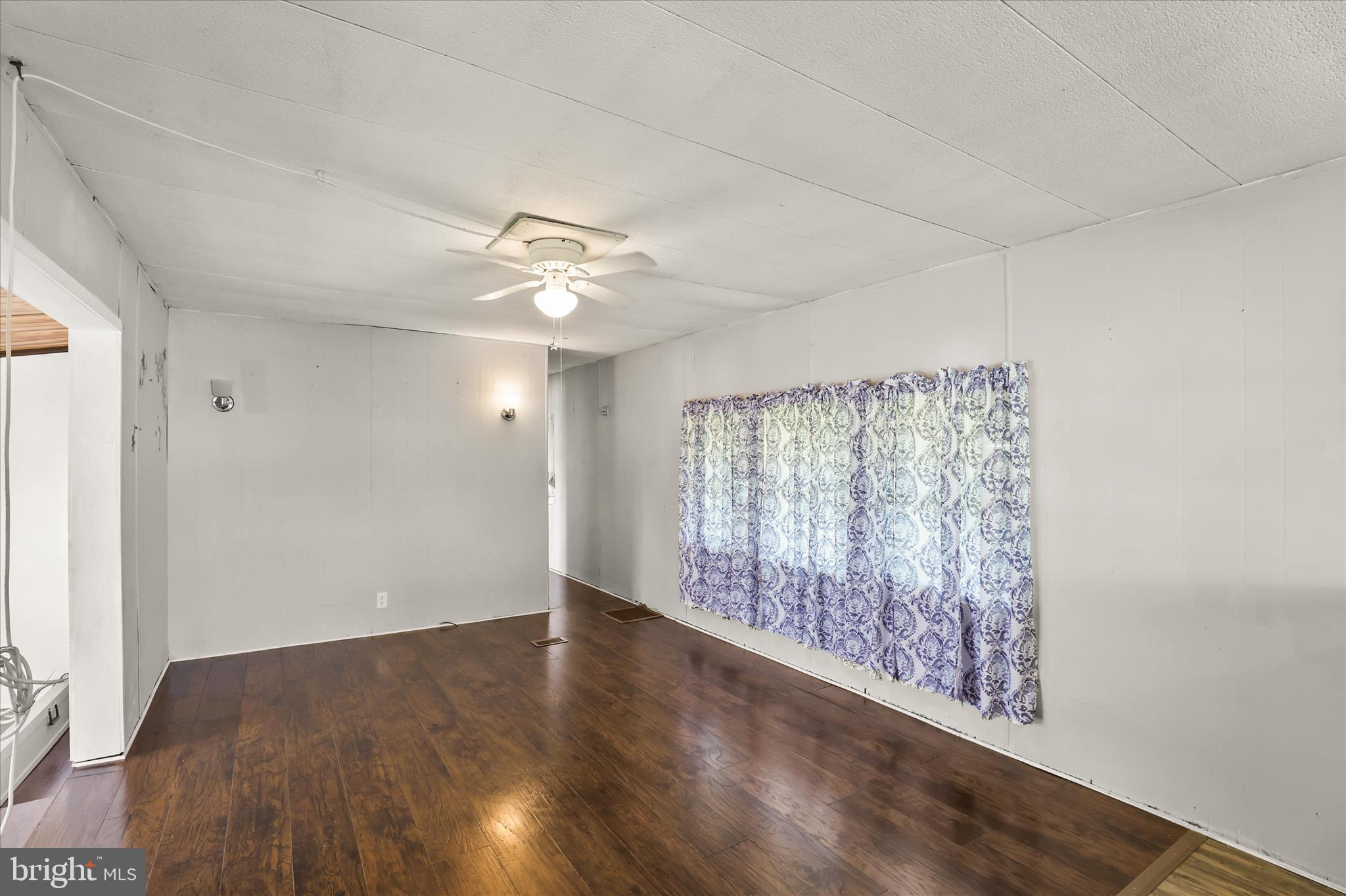 3720 Davidsburg Road, Unit A12 Dover, PA 17315 - Photo 20 of 32 wooden floor in an empty room with a window
