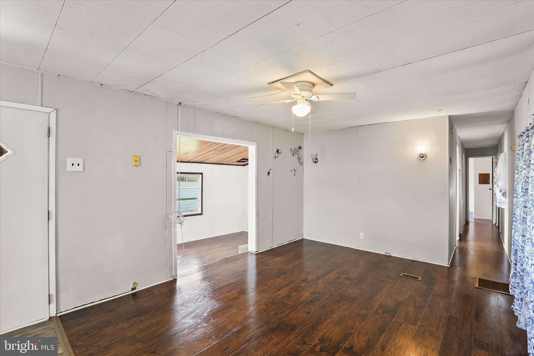 3720 Davidsburg Road, Unit A12 Dover, PA 17315 - Photo 21 of 32 an empty room with wooden floor and a ceiling fan