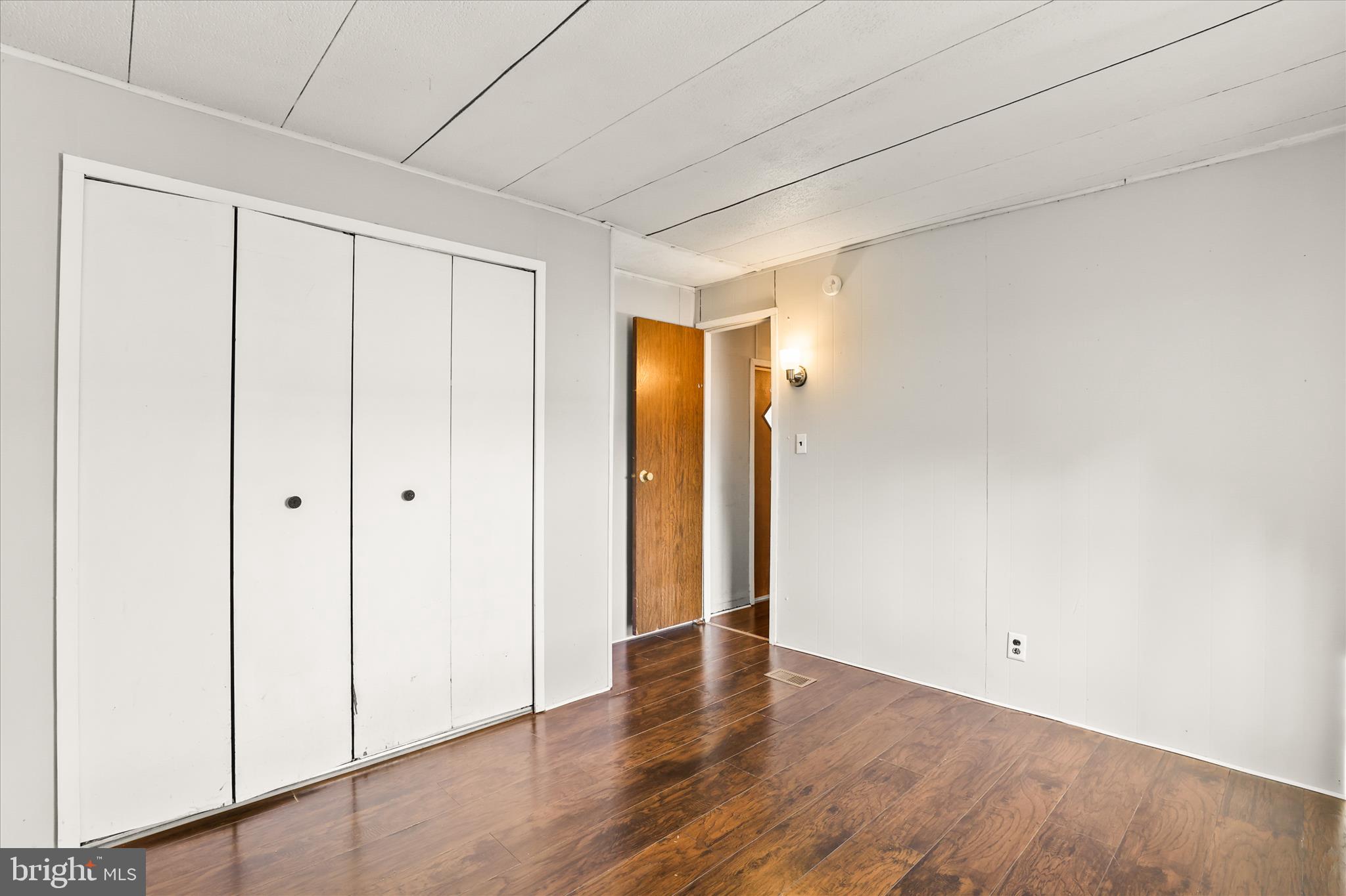 3720 Davidsburg Road, Unit A12 Dover, PA 17315 - Photo 31 of 32 a view of an empty room with wooden floor