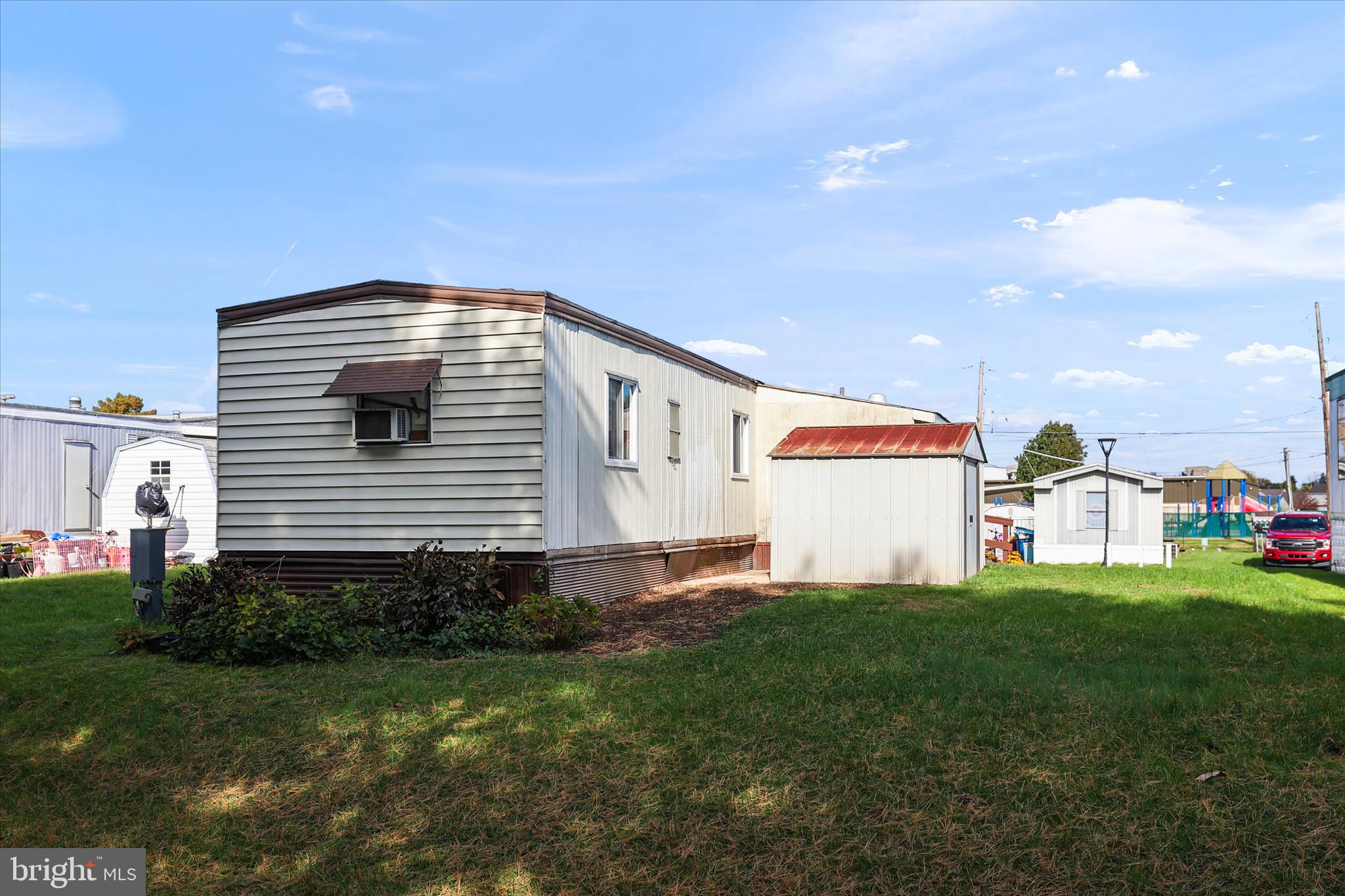3720 Davidsburg Road, Unit A12 Dover, PA 17315 - Photo 9 of 32 a front view of a house with a yard