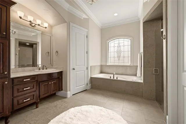a bathroom with a granite countertop sink a mirror and shower