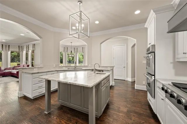 a utility room with sink dryer and washer