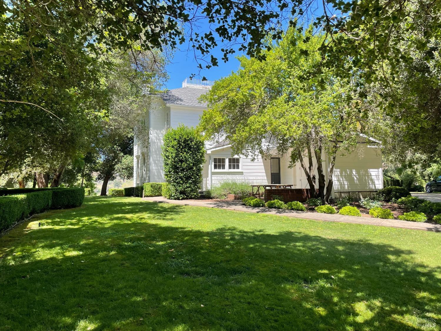 751 Crystal Springs Road St. Helena, CA 94574 - Photo 20 of 25 a front view of a house with a yard
