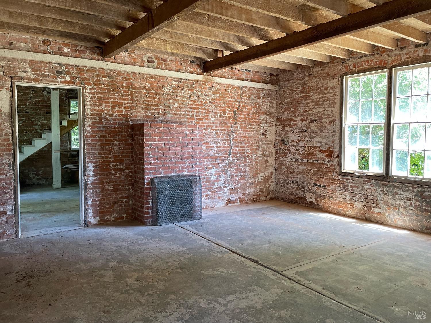 751 Crystal Springs Road St. Helena, CA 94574 - Photo 24 of 25 a view of an empty room with a fireplace
