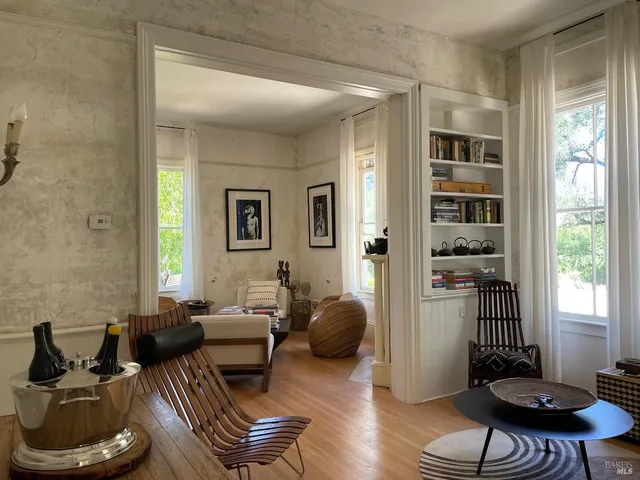 a view of a glass door with a balcony from a room