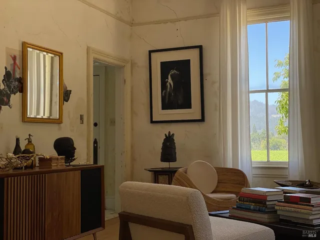 a kitchen with stainless steel appliances granite countertop a dining table and chairs
