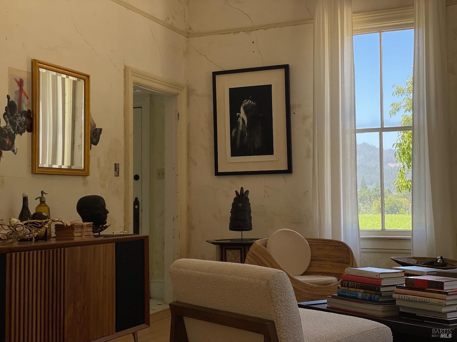 751 Crystal Springs Road St. Helena, CA 94574 - Photo 10 of 25 a living room with furniture and two windows