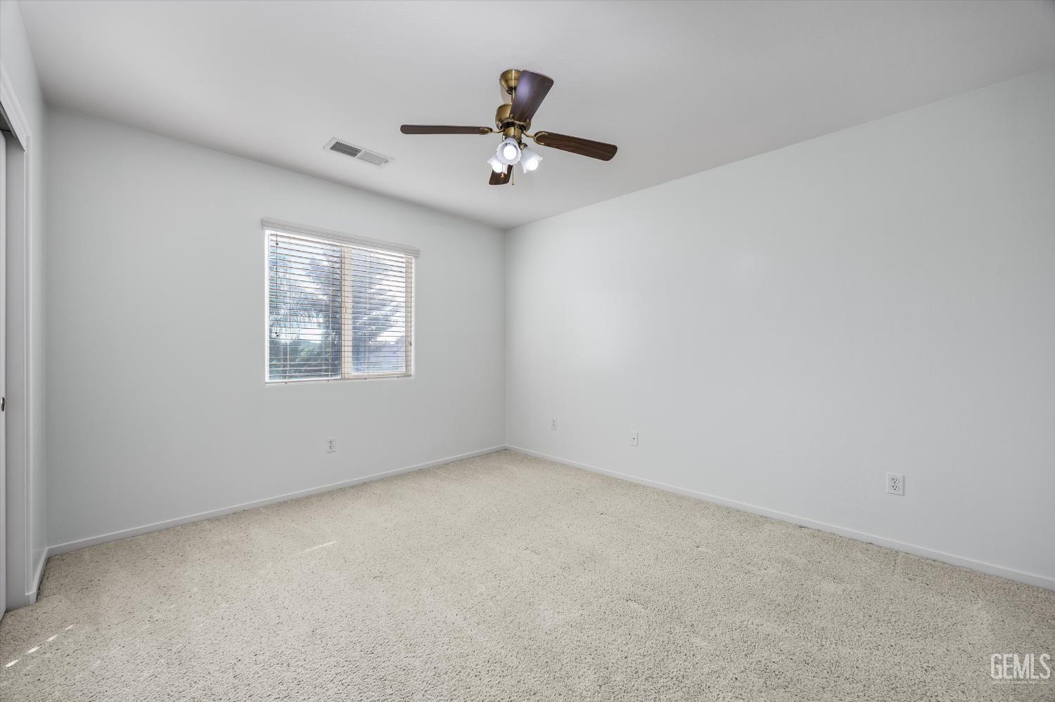 Undisclosed Address Bakersfield, CA 93312 - Photo 31 of 42 an empty room with ceiling fan and window