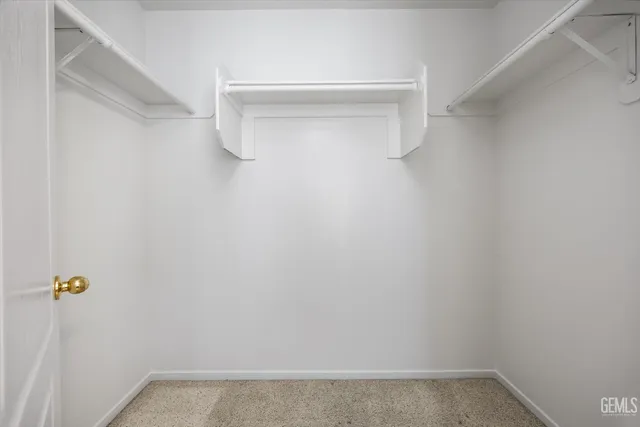 a spacious bathroom with a double vanity sink a mirror and a shower