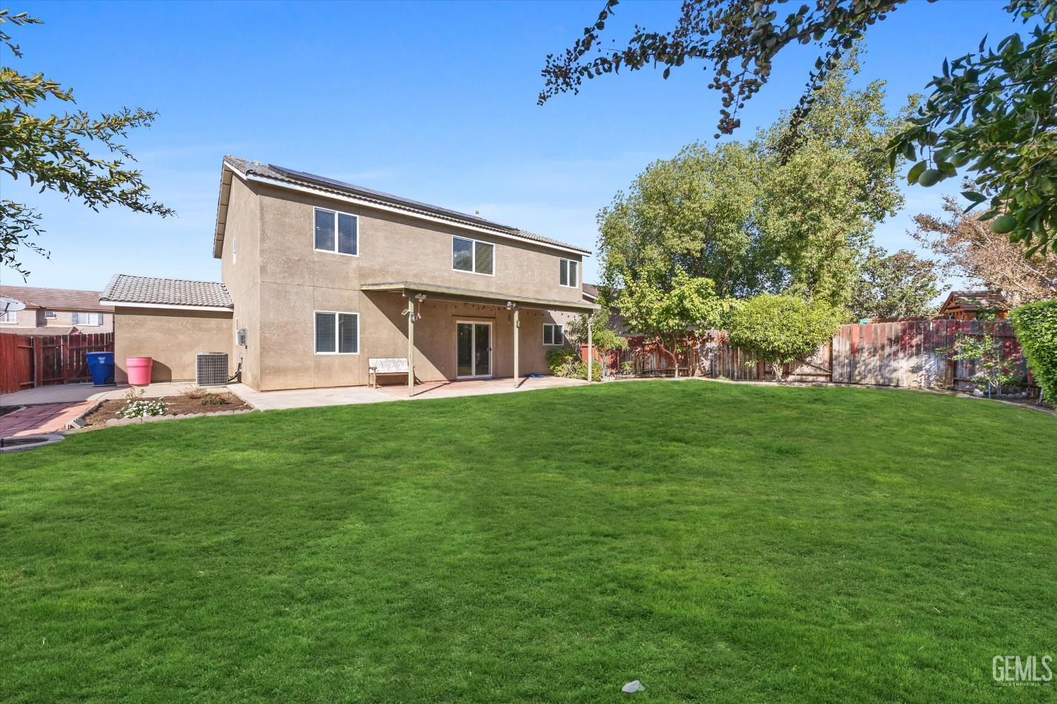 Undisclosed Address Bakersfield, CA 93312 - Photo 36 of 42 a view of a house with a backyard